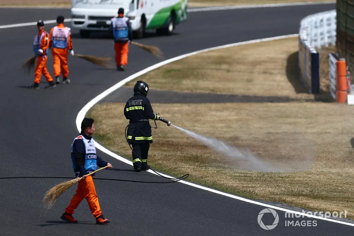 Firefighter Douses Trackside Grass