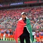 Sergio Perez Celebrates with Mexican Flag at Red Bull Racing