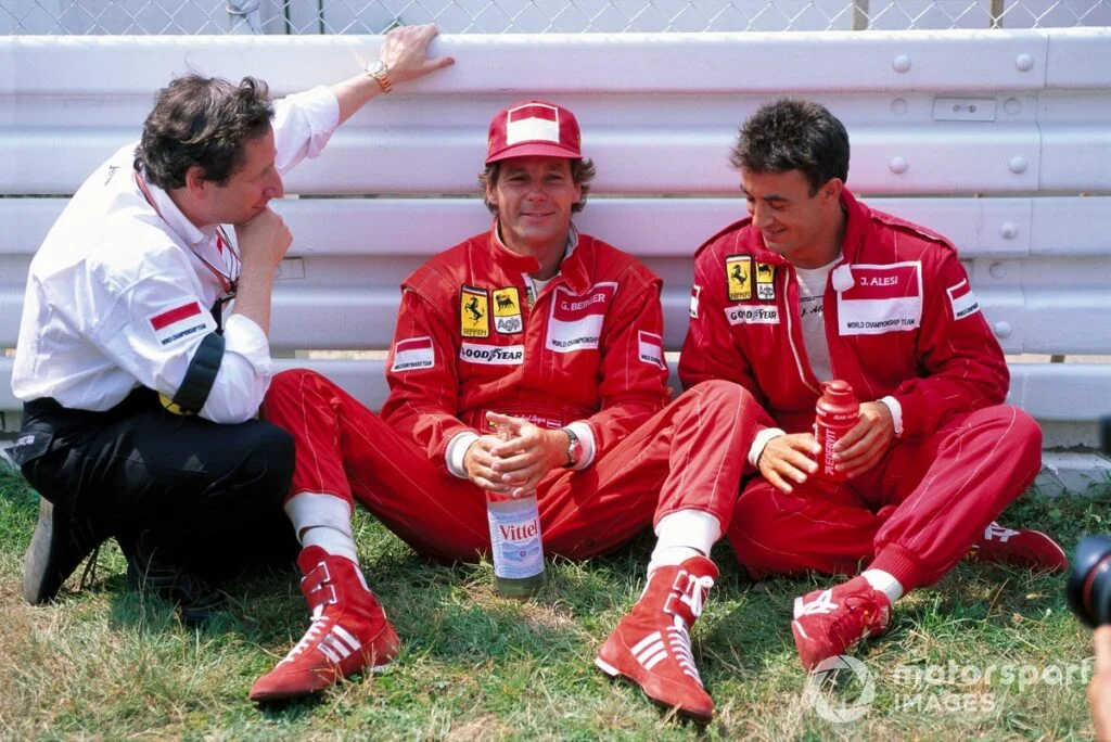 1994 German Grand Prix: Gerhard Berger, Jean Alesi, and Jean Todt in conversation (Ferrari team)