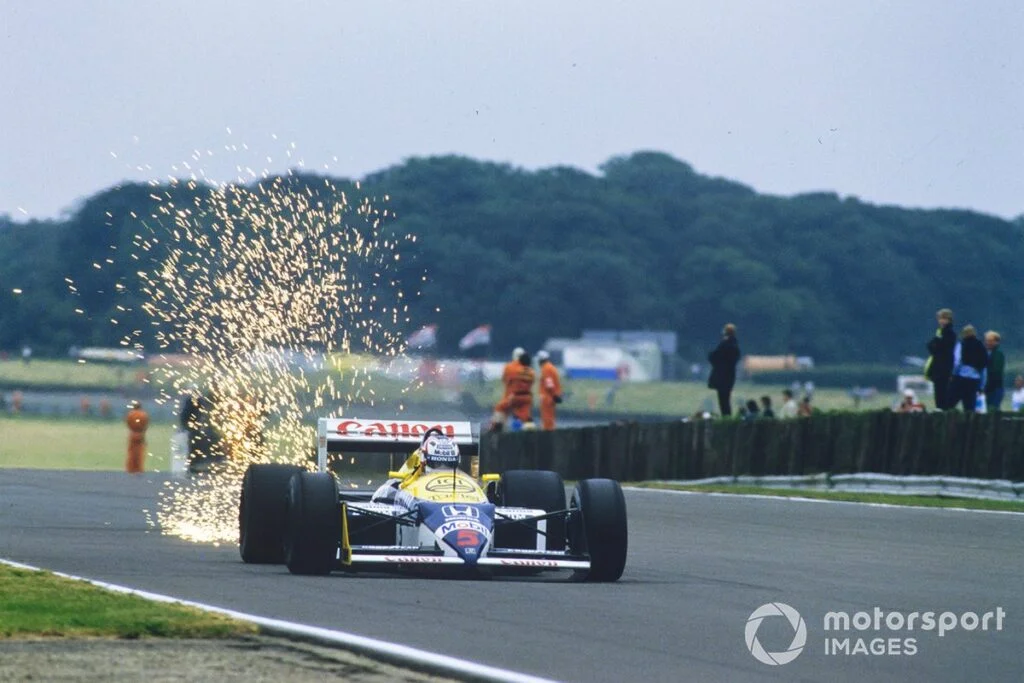 Nigel Mansell with the Williams FW11B Honda